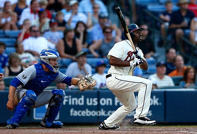 ATLANTA, GA - JULY 14: Michael Bourn #24 of the Atlanta Braves hits a one RBI single in the eighth inning against the New York Mets at Turner Field on July 14, 2012 in Atlanta, Georgia. (Photo by Kevin C. Cox/Getty Images)