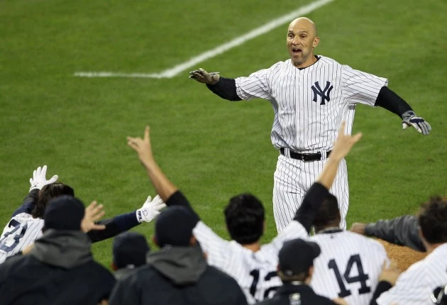 NEW YORK, NY - OCTOBER 10: Raul Ibanez #27 of the New York Yankees reaches his teammates at home place after hitting a walk off home run in the bottom of the twelfth inning against the Baltimore Orioles in Game Three of the American League Division Series at Yankee Stadium on October 10, 2012 in the Bronx borough of New York City. (Photo by Alex Trautwig/Getty Images) NEW YORK, NY - OCTOBER 10: Raul Ibanez #27 of the New York Yankees reaches his teammates at home place after hitting a walk off home run in the bottom of the twelfth inning against the Baltimore Orioles in Game Three of the American League Division Series at Yankee Stadium on October 10, 2012 in the Bronx borough of New York City. (Photo by Alex Trautwig/Getty Images)