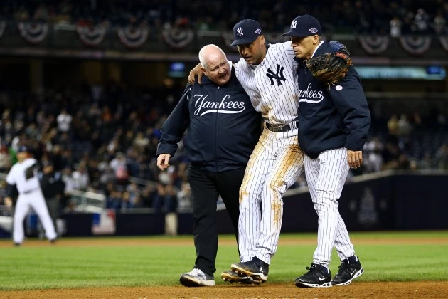 NEW YORK, NY - OCTOBER 13: Derek Jeter #2 of the New York Yankees is carried off of the field by trainer Steve Donohue (L) and manager Joe Girardi after Jeter injured his leg in the top of the 12th inning against the Detroit Tigers during Game One of the American League Championship Series at Yankee Stadium on October 13, 2012 in the Bronx borough of New York City, New York. (Photo by Al Bello/Getty Images) NEW YORK, NY - OCTOBER 13: Derek Jeter #2 of the New York Yankees is carried off of the field by trainer Steve Donohue (L) and manager Joe Girardi after Jeter injured his leg in the top of the 12th inning against the Detroit Tigers during Game One of the American League Championship Series at Yankee Stadium on October 13, 2012 in the Bronx borough of New York City, New York. (Photo by Al Bello/Getty Images)